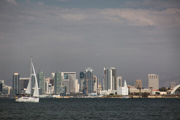 Fototapeta premium Panoramic view of San Diego skyline from the Bay with a sailing boat in the foreground