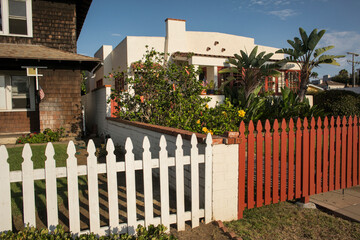 Detached houses with garden behind its fence in Orange Ave, Coronado Island, San Diego
