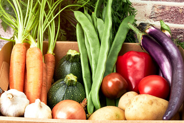 Cardboard box full of fresh vegetables. Vegan food. Healthy food