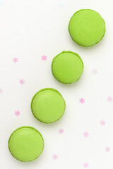 Pistachio Macarons on white background close up.