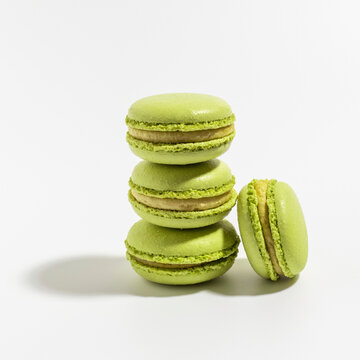 Pistachio Macarons on white background.