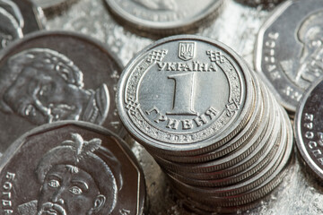 Stack of Ukrainian hryvnia coins. Reverse of the one hryvnia coin. Coinage.