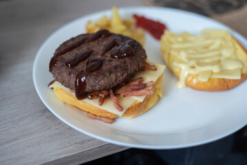 Handmade hamburger with french fries and dips made at home