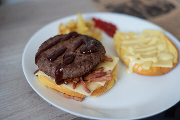 Handmade hamburger with french fries and dips made at home