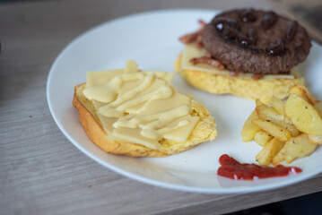 Handmade hamburger with french fries and dips made at home