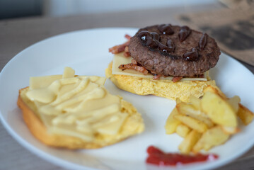 Handmade hamburger with french fries and dips made at home