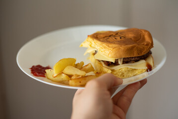 Handmade hamburger with french fries and dips made at home