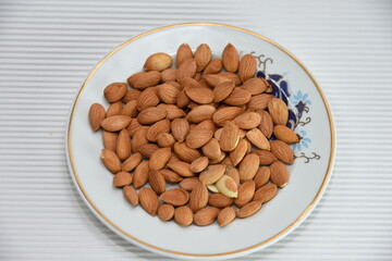 Production and consumption proccess of almonds. raw green,  raw dried and roasted almondsin