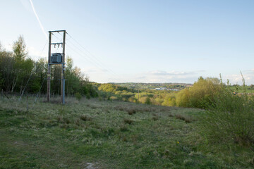 electric transformer box on wooden posts with power lines at Apedale community park