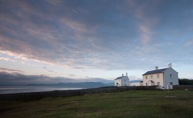 two lighthouse cottages on black point Penmon Anglsea north wales during sunrise