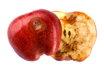 Halved rotten apple is isolated against a white background. Full clipping path. The red apple is...