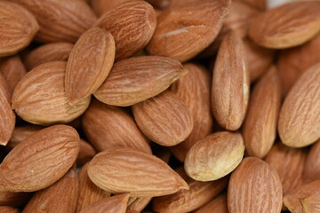 Production and consumption proccess of almonds. raw green,  raw dried and roasted almondsin