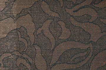 Floral old retro vintage ornament fabric in brown color on background. Cute ornament floral pattern. Background wall design. Vintage wallpaper