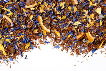Rooibos tea with cornflower and orange slices on white background. Top view. Close up. High resolution