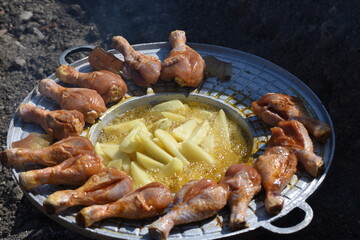 crispy chicken thighs  and fried potatoes