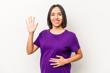 Obraz na płótnie Canvas Young hispanic pregnant woman isolated on white background smiling cheerful showing number five with fingers.