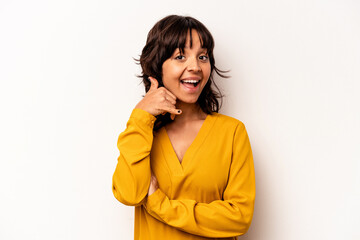 Young hispanic woman isolated on white background showing a mobile phone call gesture with fingers.