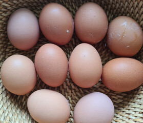 Chicken eggs in basket. Easter dinner with chicken eggs in brown baskets.