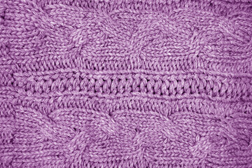 Warm knitting texture in purple tone.