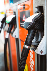 gas pump nozzles at the gas station