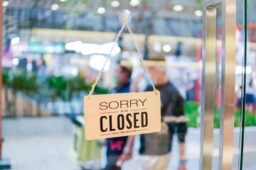 Open and close sign on the door of the restaurant.