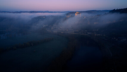Chateaux Beynac in the mist, Dordogne - France