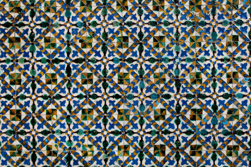 Traditional tiled wall decoration in a city palace in Seville, Spain.