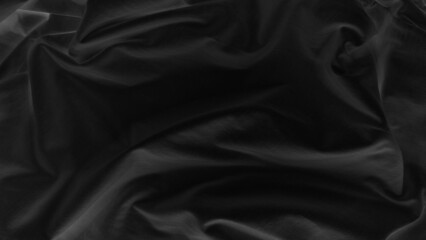black natural fabric cloth texture used for design. drapery textured. canvas for background. image has shallow depth of field. black silk texture background for elegance or stylish mood and tone.