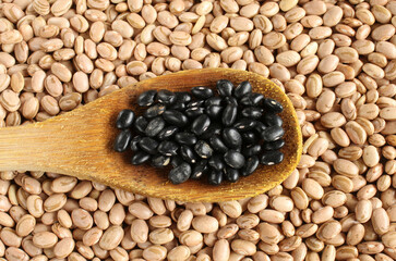 Black beans spoon. Carioca beans background