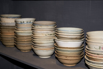 Pile of ceramic rice bowls and tea bowls close-up