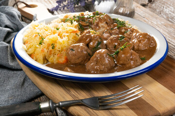 Minced meat balls in mushroom sauce.