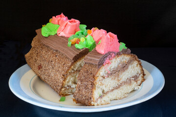 Sweet cake on a plate with a blue stripe.