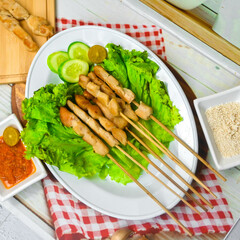 Taichan satay is a traditional food from Jakarta consisting of grilled chicken satay without soy sauce and peanut sauce