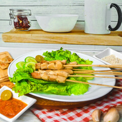 Taichan satay is a traditional food from Jakarta consisting of grilled chicken satay without soy sauce and peanut sauce
