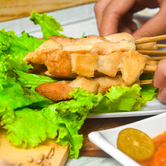 Taichan satay is a traditional food from Jakarta consisting of grilled chicken satay without soy sauce and peanut sauce
