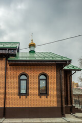 Temple of Seraphim of Sarov against a cloudy sky.