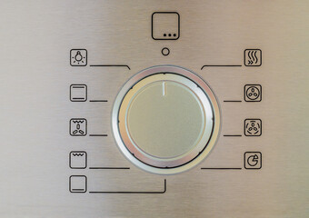 electric oven retractable control dial close up