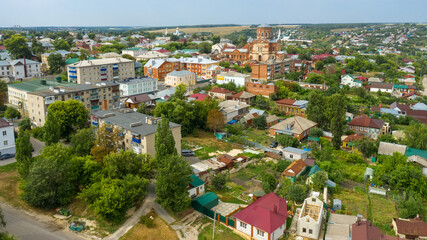 Fototapeta na wymiar Top view of a scenic view from a drone on the city of Yelets, one of the oldest cities in the Lipetsk region on the banks of the Bystraya Sosna River, Russia