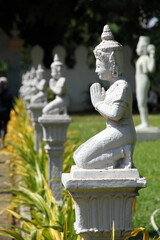 Obraz premium praying stone statue, buddism religion