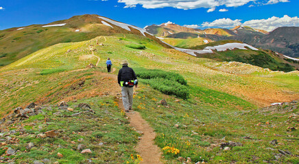 Hikers walking along the Continental Divide above 12,000 feet near Colorado's Loveland Pass