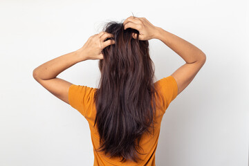 Women itching scalp itchy his hair and was massage her hair on a white background,Haircare concept - obrazy, fototapety, plakaty