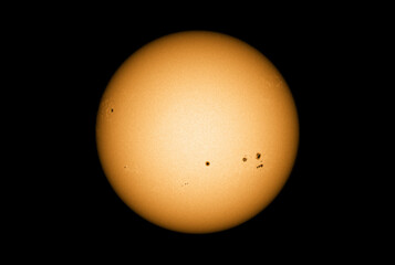 Sun in dark space with solar spots on the 25th April 2022