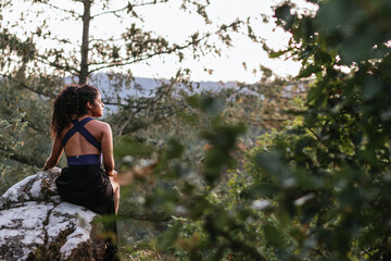 young woman enjoying walk in mountains