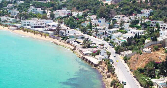 Aerial Panning Beautiful View Of Houses On Hill, Drone Flying Over Sea - Djerba, Tunisia