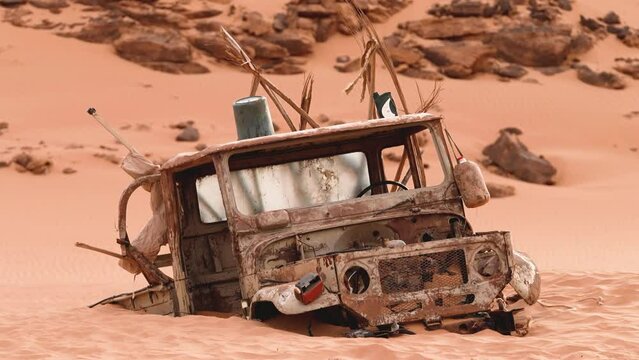 a completely rusty car abandoned in the desert
