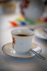 Easter dinner is served with boiled eggs, glass of rose wine, water and coffee
