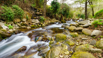 Panoramic, stream of water coming down from the mountain in the pretty village of Hervas, Caceres.