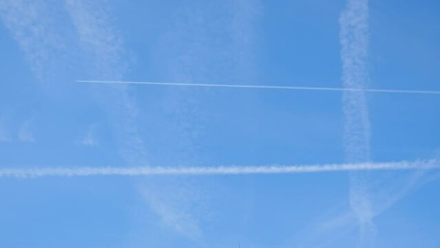 Stripes in the sky from aircraft. Selective focus.