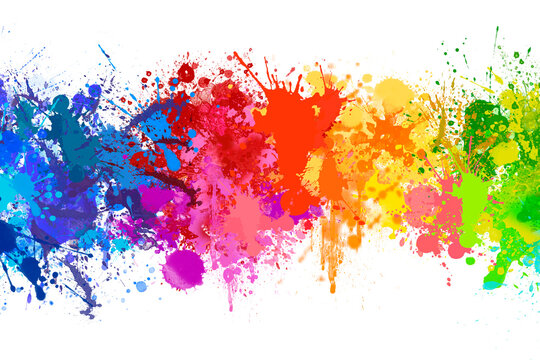 Splashing colorful watercolor colors on paper to create a background texture