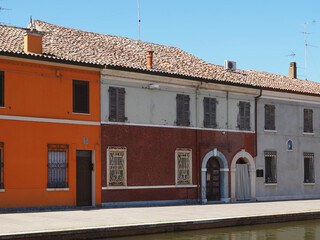 Comacchio, Italy. Old town, houses along the canal bank.
